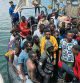 Migrants, whose boats sank in the sea and who were rescued by the Libyan Coast Guards at the Mediterranean Sea, arrive on a boat at the port, in Garaboli, Libya June 8, 2023. REUTERS/Ayman al-Sahili
