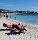 FILE PHOTO: People enjoy the sunny weather on Magaluf beach, on the Balearic island of Mallorca, Spain April 6, 2023. REUTERS/Enrique Calvo/File Photo