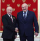 (FILES) Russian President Vladimir Putin greets Belarus' President Alexander Lukashenko at the Kremlin prior to the Victory Day military parade in central Moscow on May 9, 2023. The chief of the rebel Wagner mercenary force, Yevgeny Prigozhin, will leave Russia and won't face charges after calling off his troops' advance on June 24, 2023,  Moscow said, easing Russia's most serious security crisis in decades. Belarusian leader Alexander Lukashenko said he had negotiated a truce with Prigozhin, drawing thanks from Moscow. (Photo by Vladimir Smirnov / SPUTNIK / AFP)