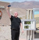Scott Hughes, of Swansea, Wales, UK, takes a selfie next to a digital display of an unofficial heat reading at Furnace Creek Visitor Center during a heat wave in Death Valley National Park in Death Valley, California, on July 16, 2023. Tens of millions of Americans braced for more sweltering temperatures Sunday as brutal conditions threatened to break records due to a relentless heat dome that has baked parts of the country all week. By the afternoon of July 15, 2023, California's famous Death Valley, one of the hottest places on Earth, had reached a sizzling 124F (51C), with Sunday's peak predicted to soar as high as 129F (54C). Even overnight lows there could exceed 100F (38C). (Photo by Ronda Churchill / AFP)