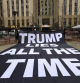 Anti-Trump protestors hold a banner in a park near the Manhattan Criminal Court, as Manhattan District Attorney Alvin Bragg's office investigates $130,000 paid in the final weeks of former U.S. President Donald Trump's 2016 election campaign to Stormy Daniels, a porn star who said she had a sexual encounter with Trump in 2006 when he was married to his current wife Melania, in New York City, U.S., March 23, 2023. REUTERS/Mike Segar