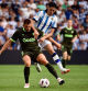 Girona's Spanish midfielder #05 David Lopez (L) vies with Real Sociedad's Spanish forward #09 Carlos Fernandez during the Spanish Liga football match between Real Sociedad and Girona FC at the Reale Arena stadium in San Sebastian on August 12, 2023. (Photo by ANDER GILLENEA / AFP)