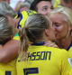 Sweden's defender Magdalena Eriksson (C) kisses her girlfriend Danish international Pernille Harder (R) as she celebrates her team's victory at the end of the France 2019 Women's World Cup third place final football match between England and Sweden, on July 6, 2019, at Nice stadium in Nice south-eastern France. (Photo by Valery HACHE / AFP)