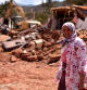 Ouercane (Morocco), 12/09/2023.- A woman looks as local residents remove their belongings from a collapsed building during clean-up work in Ouercane, Morocco, 12 September 2023. The magnitude 6.8 earthquake that struck central Morocco late 08 September has killed more than 2,800 people, damaging buildings from villages and towns in an area stretching from the Atlas Mountains to Marrakesh, according to the country's Interior Ministry. Morocco's King Mohammed VI on 09 September declared a three-day national mourning for the victims of the earthquake. (Terremoto/sismo, Marruecos) EFE/EPA/JALAL MORCHIDI