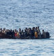A vessel with migrants approaches the Sicilian island of Lampedusa, Italy, September 16, 2023. REUTERS/Yara Nardi