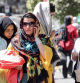 A woman speaks on a cell phone while walking along a street in Tehran on September 10, 2023. Iranian authorities have blocked popular social media networks, including Instagram and WhatsApp since mass protests erupted following the September 2022 death in police custody of 22-year-old Iranian Kurd Mahsa Amini. The restrictions come as millions of Iranians struggle to make ends meet, grappling with in an economic crisis marked by crippling Western sanctions, a galloping inflation, and sharp decline of the local currency. (Photo by ATTA KENARE / AFP)