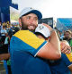 ROME, ITALY - OCTOBER 01: Rory McIlroy and Jon Rahm of Team Europe celebrate following victory with 16 and a half to 11 and a half win following the Sunday singles matches of the 2023 Ryder Cup at Marco Simone Golf Club on October 01, 2023 in Rome, Italy. (Photo by Jamie Squire/Getty Images)