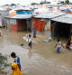 FILE PHOTO: Internally displaced Somali children wade through flood waters outside their makeshift shelters following heavy rains at the Al Hidaya camp for the internally displaced people on the outskirts of Mogadishu, Somalia November 6, 2023 REUTERS/Feisal Omar/File Photo