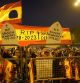 People protest behind security barriers during the investiture debate a day before the Socialist leader seeks the endorsement of the chamber to form a new government at the nearby Spanish Parliament in Madrid Spain, Wednesday, Nov. 15, 2023. Demonstrators are protesting Spain's Socialist's deal to grant amnesty to Catalan separatists in exchange for support of new government. (AP Photo/Andrea Comas)