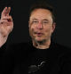 File - Elon Musk, owner of social media platform X, gestures during an event with Britain's Prime Minister Rishi Sunak in London on Nov. 2, 2023. IBM has stopped advertising on X after a report said its ads were appearing alongside material praising Adolf Hitler and Nazis. (AP Photo/Kirsty Wigglesworth, Pool, File)
