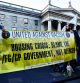 People hold a banner during a vigil denouncing violence of riots, following the stabbing of school children, in Dublin, Ireland November 27, 2023. REUTERS/Clodagh Kilcoyne
