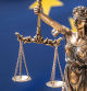 The statue of justice, goddess of justice in front of European union flag.