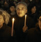 People hold candles as Jewish rabbis and members of the community demand a permanent ceasefire in Gaza during the first night of the Jewish holiday of Hanukkah on Thursday, Dec. 7, 2023, in New York. (AP Photo/Andres Kudacki)