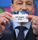 UEFA Champions League ambassador and British former football player, John Terry holds the paper slip of SSC Napoli during the 2023-2024 UEFA Champions League football tournament round of 16 draw at the House of European Football in Nyon, on December 18, 2023. (Photo by Fabrice COFFRINI / AFP)