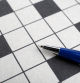 Pen and blank crossword, closeup. Space for text