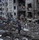 A woman looks at her apartment building heavily damaged by a Russian missile strike, amid Russia's attack on Ukraine, in Kyiv, Ukraine January 2, 2024. REUTERS/Viacheslav Ratynskyi