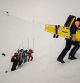 Rescuers take part in a search and rescue exercise for avalanche victims in the French Alps ski resort of Les Deux Alpes, south-eastern France on December 20, 2023. (Photo by JEFF PACHOUD / AFP)