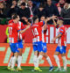 Girona's Spanish midfielder #23 Ivan Martin (2R) celebrates with teammates scoring his team's fourth goal during the Spanish league football match between Girona FC and Club Atletico de Madrid at the Montilivi stadium in Girona on January 3, 2024. (Photo by Pau BARRENA / AFP)