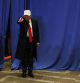 Former U.S. President and Republican presidential candidate Donald Trump gestures as he campaigns in Indianola, Iowa, U.S., January 14, 2024. REUTERS/Brendan McDermid