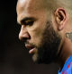 (FILES) In this file photo taken on March 13, 2022 Barcelona's Brazilian defender Dani Alves looks on during the Spanish league football match between FC Barcelona and CA Osasuna at the Camp Nou stadium in Barcelona. - Brazil defender Dani Alves was back in court on April 17, 2023 to testify before the judge investigating a rape allegation made by a woman in Barcelona for which he has been held in pre-trial detention. The 39-year-old, who has been remanded in custody since January 20, appeared in court at his own request, giving a 30-minute statement to the judge in which he reiterated his claim that the sex was consensual, judicial sources said. (Photo by Josep LAGO / AFP)