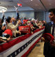 A man distributes hats to supporters of Republican presidential candidate and former U.S. President Donald Trump during his New Hampshire presidential primary election night watch party in Nashua, New Hampshire, U.S. January 23, 2024. REUTERS/Mike Segar     TPX IMAGES OF THE DAY