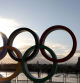 (FILES) People take pictures of the Olympic rings installed on the Esplanade du Trocadero near the Eiffel tower following the Paris' nomination as host for the 2024 Olympics, on September 14, 2017 in Paris. January 26, 2024 marks the six-month countdown to the opening ceremony kicking off the Paris 2024 Olympic Games which begin on July 26, 2024. (Photo by LUDOVIC MARIN / AFP)