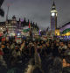 LONDON, ENGLAND - FEBRUARY 21: People hold placards and Palestinian flags during a rally calling for a ceasefire, outside parliament as MPs consider a motion on Gaza on February 21, 2024 in London, England. Westminster held a second vote on calling for a ceasefire this week. The Scottish National Party (SNP) have returned the motion after using the King's Speech debate to push for an immediate ceasefire in Gaza in November 2023. This move led to several Labour frontbenchers resigning following their support for the SNP amendment. (Photo by Dan Kitwood/Getty Images)
