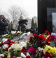 A person embraces Russian opposition leader Alexei Navalny's mother, Lyudmila Navalnaya, left, while his mother-in-law, no name available, center, stands near while visiting the grave of Alexei Navalny after his yesterday funeral at the Borisovskoye Cemetery, in Moscow, Russia, on Saturday, March 2, 2024. Navalny, who was President Vladimir Putin's fiercest foe, was buried after a funeral that drew thousands of mourners amid a heavy police presence. (AP Photo)