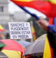 A demonstrator holds a sign calling for Spanish Prime Minister Pedro Sanchez and Catalan politician Carles Puigdemont to go to prison, at a protest by conservative and far-right parties and civil society organizations at Cibeles Square in Madrid, Spain, March 9, 2024. REUTERS/Ana Beltran