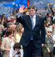 Exiled Catalan separatist leader, Spanish member of the European Parliament and founder of the Junts per Catalunya (Together for Catalonia) party Carles Puigdemont waves as he gives a speech during a meeting to present his list for the upcoming regional elections in Catalonia, on April 6, 2024, in Elna, southwestern France. (Photo by Matthieu RONDEL / AFP)