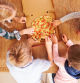 Children sharing a pizza together, overhead view