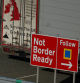 FILE PHOTO: Heavy goods trailers are seen near a 'Not Border Ready' sign in a lorry park at the Port of Holyhead in Holyhead, Britain, January 30, 2024 REUTERS/Phil Noble/File Photo