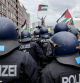 Police officers try to stop people taking part in a pro-Palestinian rally in Berlin, Saturday, May 18, 2024. Police said that thousands of people took part in a pro-Palestinians protest rally in Berlin. (AP Photo/ Ebrahim Noroozi)