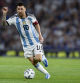 FILE - Argentina's Lionel Messi controls the ball during a qualifying soccer match for the FIFA World Cup 2026 against Uruguay at La Bombonera stadium in Buenos Aires, Argentina, Thursday, Nov. 16, 2023. Two players regarded as key for Argentina's renovation will be in the United States for the tournament, Brighton left back Valentín Barco and Monza striker Valentín Carboni. (AP Photo/Gustavo Garello, File)