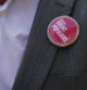 A pin on the New Popular Front, a left-wing electoral coalition of political parties, is seen on the lapel of former Deputy of the French National Assembly Stephane Peu takes part in an anti far-right rally in Saint-Denis on June 27, 2024, ahead of France's upcoming legislative elections. (Photo by Zakaria ABDELKAFI / AFP)