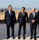 (From L) Britain's Foreign Secretary David Cameron, France's President Emmanuel Macron, German Chancellor Olaf Scholz and US President Joe Biden unite to pose during the International commemorative ceremony at Omaha Beach marking the 80th anniversary of the World War II 