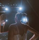 Photo of a ballerina backstage, waiting for the show to begin and anticipating her performance.
