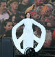 Serbian conceptual and performance artist Marina Abramovic performs on the Pyramid stage as she calls on the crowds to hold a seven-minute silence on the third day of the Glastonbury festival at Worthy Farm in the village of Pilton in Somerset, southwest England, on June 28, 2024. The festival takes place from June 26 to June 30. (Photo by Oli SCARFF / AFP) / RESTRICTED TO EDITORIAL USE - MANDATORY MENTION OF THE ARTIST UPON PUBLICATION - TO ILLUSTRATE THE EVENT AS SPECIFIED IN THE CAPTION