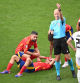 English referee Anthony Taylor gestures to medics as Spain's midfielder #20 Pedri lies on the football pitch during the UEFA Euro 2024 quarter-final football match between Spain and Germany at the Stuttgart Arena in Stuttgart