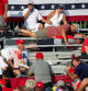 TOPSHOT - Trump supporters are seen covered with blood in the stands after guns were fired at Republican candidate Donald Trump at a campaign event at Butler Farm Show Inc. in Butler, Pennsylvania, July 13, 2024. Republican candidate Donald Trump was evacuated from the stage at today's rally after what sounded like shots rang out at the event in Pennsylvania, according to AFP. The former US president was seen with blood on his right ear as he was surrounded by security agents, who hustled him off the stage as he pumped his first to the crowd. Trump was bundled into an SUV and driven away. (Photo by Rebecca DROKE / AFP)