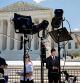 WASHINGTON, DC - JULY 01: Journalists Yamiche Alcindor (L) and Ken Dilanian (3L) report from outside the U.S. Supreme Court on July 01, 2024 in Washington, DC. The Supreme Court released its ruling in Trump v. United States, stating that a former president has absolute immunity for official acts but that immunity is not extended for unofficial acts.   Chip Somodevilla/Getty Images/AFP (Photo by CHIP SOMODEVILLA / GETTY IMAGES NORTH AMERICA / Getty Images via AFP)