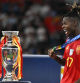 Spain's midfielder #17 Nico Williams celebrates with his silver medal next to the trophy after winning the UEFA Euro 2024 final football match between Spain and England at the Olympiastadion in Berlin on July 14, 2024. (Photo by JAVIER SORIANO / AFP)