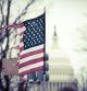 broken US flag with the US capitol in the background