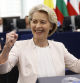 European Commission President Ursula von der Leyen, right, reacts after the announcement of the vote at the European Parliament in Strasbourg, eastern France, Thursday, July 18, 2024. Lawmakers at the European Parliament have re-elected Ursula von der Leyen to a second 5-year term as president of the European Union's executive commission. The re-election ensures leadership continuity for the 27-nation bloc as it wrestles with crises ranging from the war in Ukraine to climate change, migration and housing shortages. (AP Photo/Jean-Francois Badias)