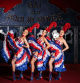 (FILES) (From L) Moulin Rouge's dancer, Fanny, Keira et Alana, wearing French Cancan outfits made of petticoat, knickers and corset, garter and ankle boots, pose at the entrance of the cabaret 
