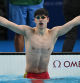 TOPSHOT - China's Pan Zhanle reacts after winning gold and breaking a world record in the final of the men's 100m freestyle swimming event during the Paris 2024 Olympic Games at the Paris La Defense Arena in Nanterre, west of Paris, on July 31, 2024. (Photo by Jonathan NACKSTRAND / AFP)
