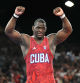 Cuba's Mijain Lopez Nunez celebrates after beating Chile's Yasmani Acosta Fernandez in their men's greco-roman 130kg wrestling final match at the Champ-de-Mars Arena during the Paris 2024 Olympic Games, in Paris on August 6, 2024. (Photo by Punit PARANJPE / AFP)