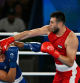 Uzbekistan's Bakhodir Jalolov and Spain's Ayoub Ghadfa Drissi El Aissaoui (Blue) compete in the men's +92kg final boxing match during the Paris 2024 Olympic Games at the Roland-Garros Stadium, in Paris on August 10, 2024. (Photo by MOHD RASFAN / AFP)