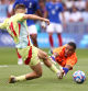 PARIS, FRANCE - AUGUST 09: Guillaume Restes #16 of Team France fails to save as Fermin Lopez #11 of Team Spain scores his team's second goal during the Men's Gold Medal match between France and Spain during the Olympic Games Paris 2024 at Parc des Princes on August 09, 2024 in Paris, France. (Photo by Robert Cianflone/Getty Images)