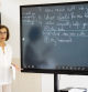 English teacher using an smart board in a high school.